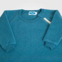 Baby Schlafsack von Reiff aus Wollfleece mit Armen in pazifik 2