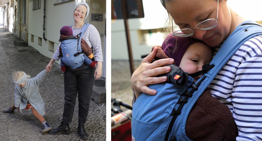 Babytrage von Ruckelie mit Baby vor den Bauch geschnallt.